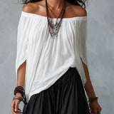 Ensemble haut blanc à épaules dénudées et pantalon évasé style lanterne