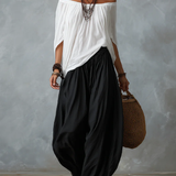 Ensemble haut blanc à épaules dénudées et pantalon évasé style lanterne